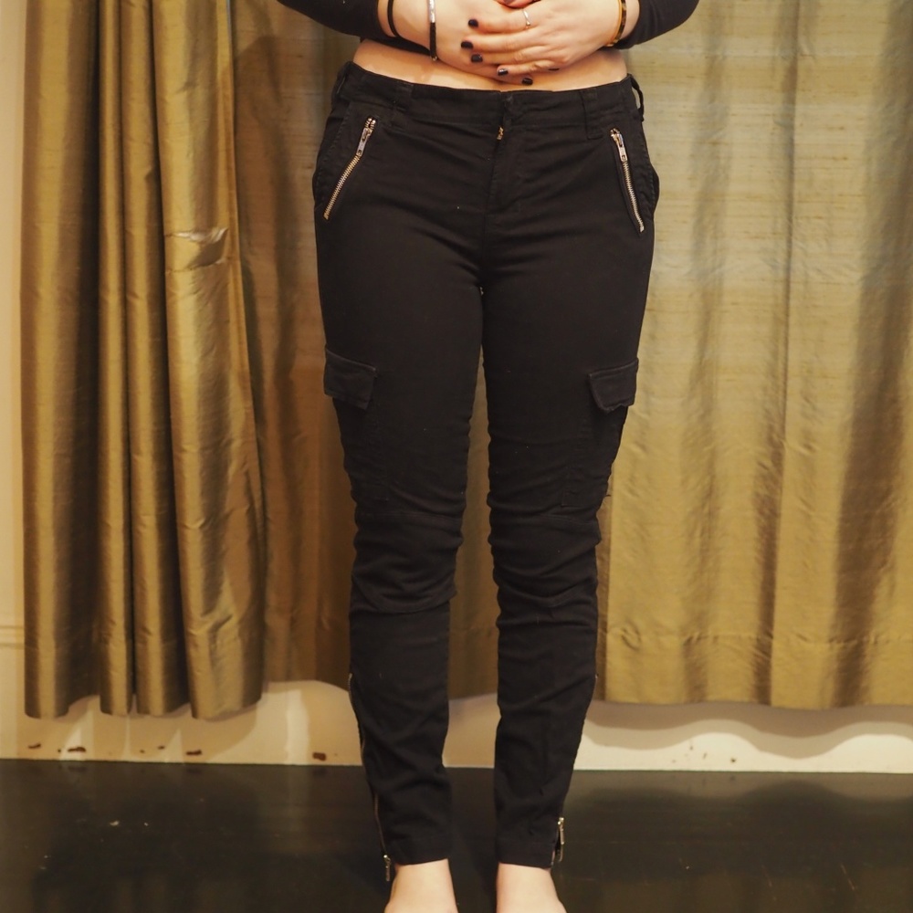 Black, fitted, cargo-zipper pants.